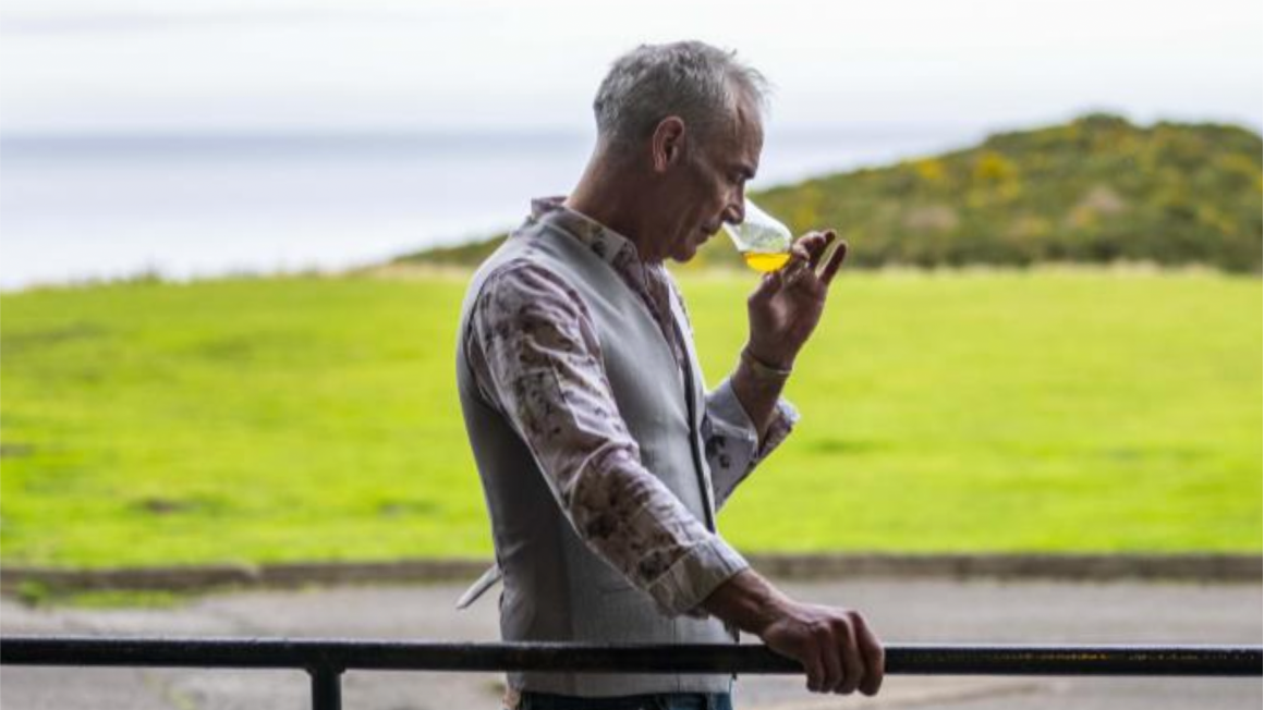 Picture of Stewart Buchanan smelling Glenglassaugh out of a glass.